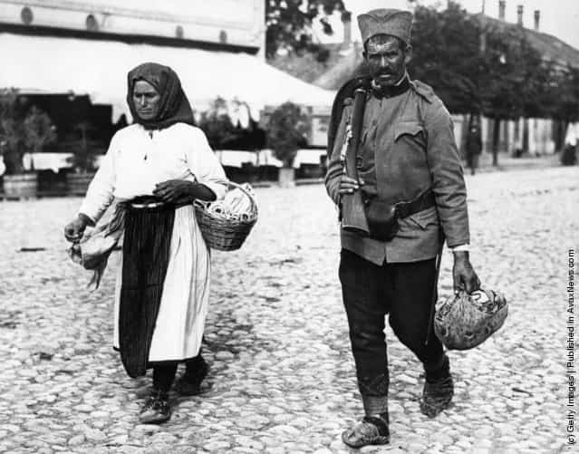1914: A Serbian soldier of to the front is accompanied to the station by his wife