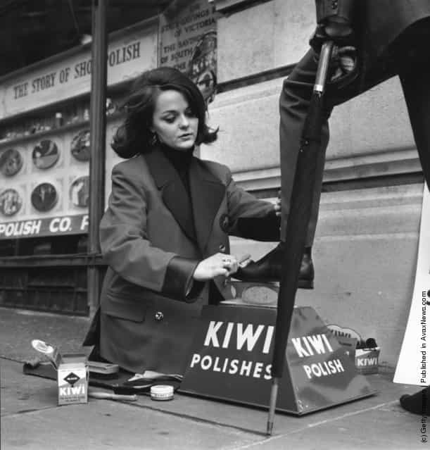 A female bootblack working in the Strand, London