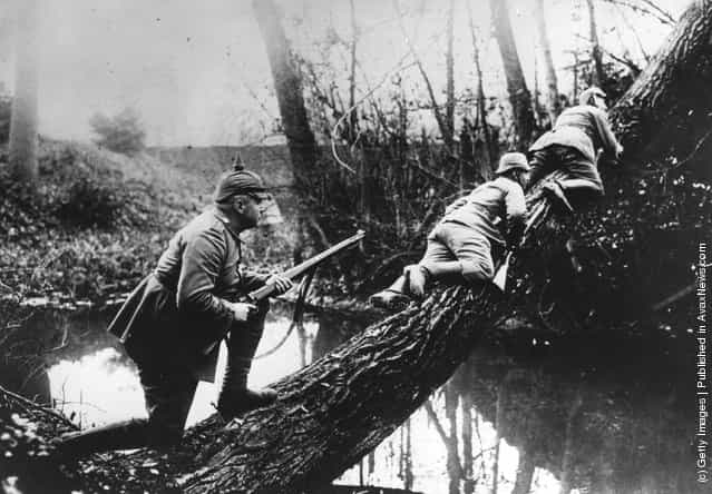 German sharpshooters move to a position near the front line, during the fighting near the Aisne River, 1914