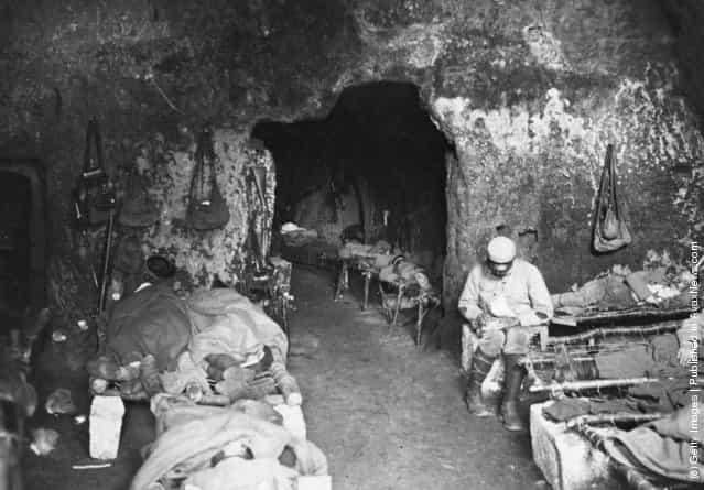 1914: Injured soldiers rest in a cave in France