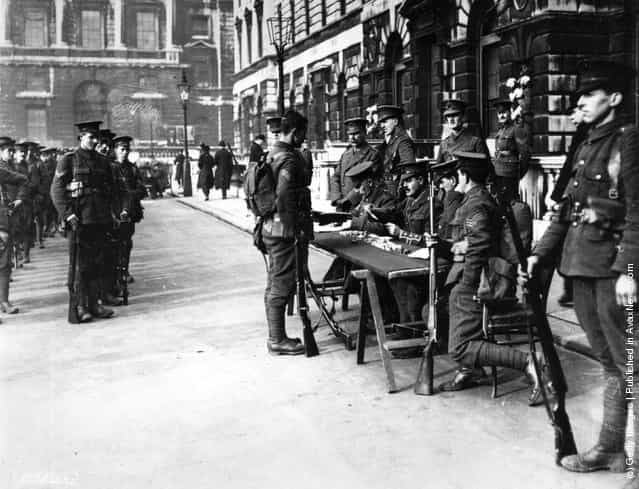 1914: Members of the 15th London Regiment receive their pay outside Somerset House, soon after mobilisation