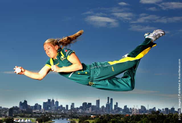 Victorian and Australian women's cricket team representative Meg Lanning dives for a catch during a photo shoot at Quarry Park
