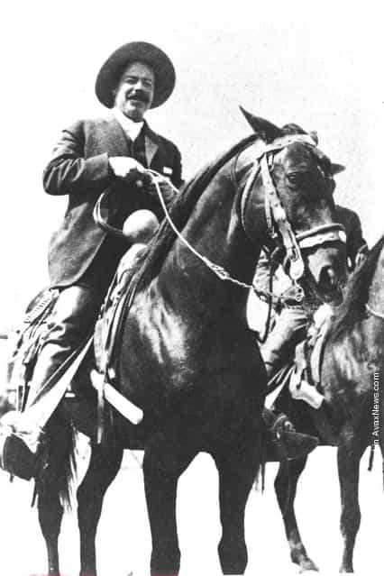 Mexican revolutionary Pancho Villa (1878 - 1923) smiles while sitting on horseback, c. 1911