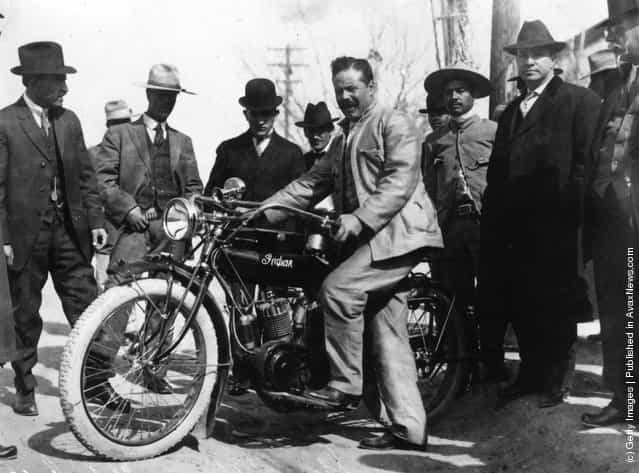 1914: Mexican rebel leader Francisco Pancho Villa (1877-1923) with one of the motorcycles used in the Battle of Torrero