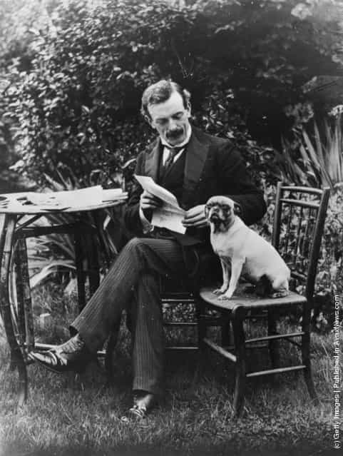 1904: Politician and Liberal prime minister David Lloyd George, with his dog in the garden