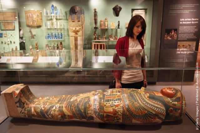 A woman views the Mummy of Meresamun