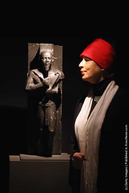 Sue Goddard views a statue of King Taharqa in the Shrine of Taharqa in the Ashmolean Museums new exhibition of artifacts