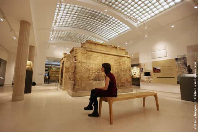 A woman views the Shrine of Taharqa in the Ashmolean Museums new exhibition of artifacts from ancient Egypt and Nubia
