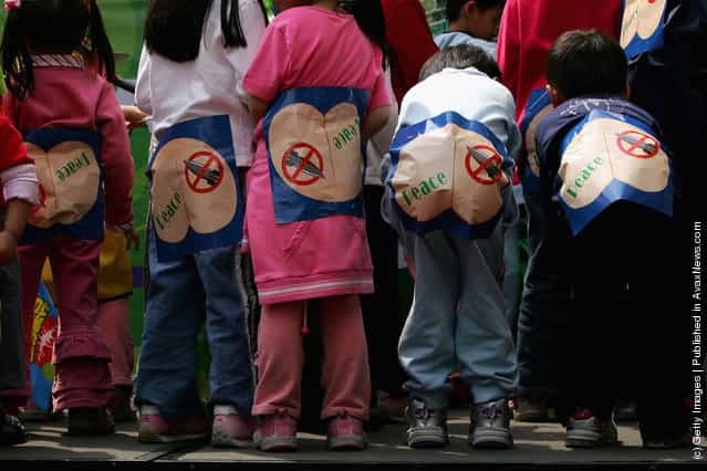 Taiwanese children participate in a rally to protest against the anti-secession law
