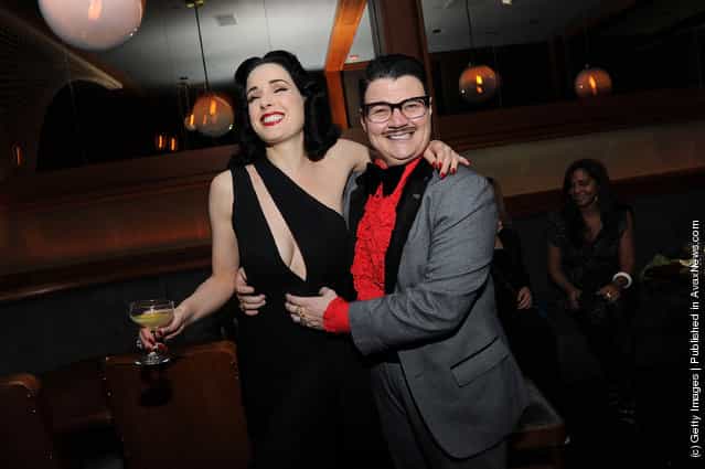 Dita Von Teese and Murray Hill attend 'My Cointreau Travel Essentials' Vintage-Inspired Travel Bar at Forty Four at the Royalton