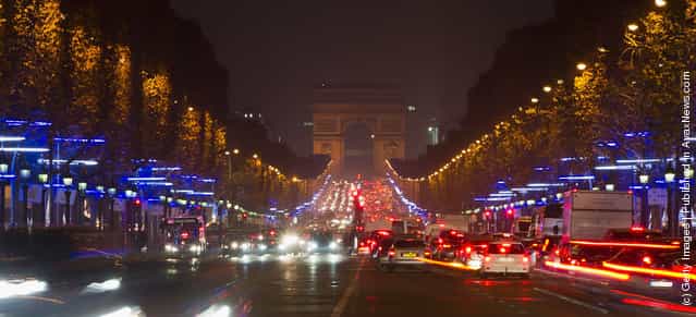 Christmas illuminations are lit along the Champs Elysees avenue on November 23, 2011 in Paris, France
