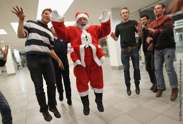 Stephan Stippi Antczack, alias Santa Claus, leads Santas-to-be in a theatrical exercise as part of his Santa workshop at the Studentenwerk Berlin