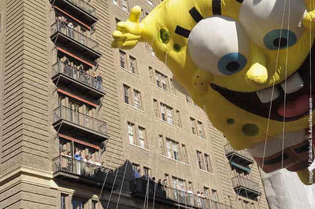 The SpongeBob SquarePants balloon makes it's way through NYC streets during the 85th Annual Macy's Thanksgiving Day Parade
