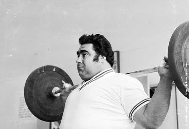 1975: World weightlifting champion Vasily Alexeyev pumps iron