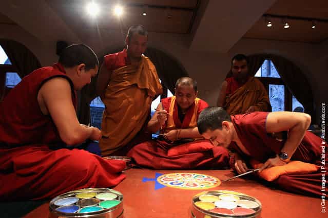 Tibetan Monks From The Panchen Lamas Monastery Create A Sand Mandala Artwork