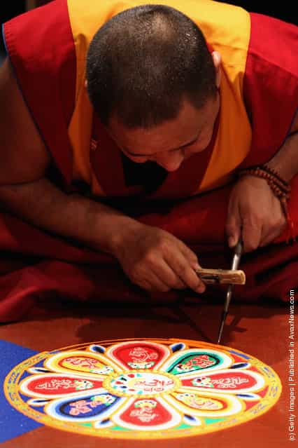 Tibetan Monks From The Panchen Lamas Monastery Create A Sand Mandala Artwork