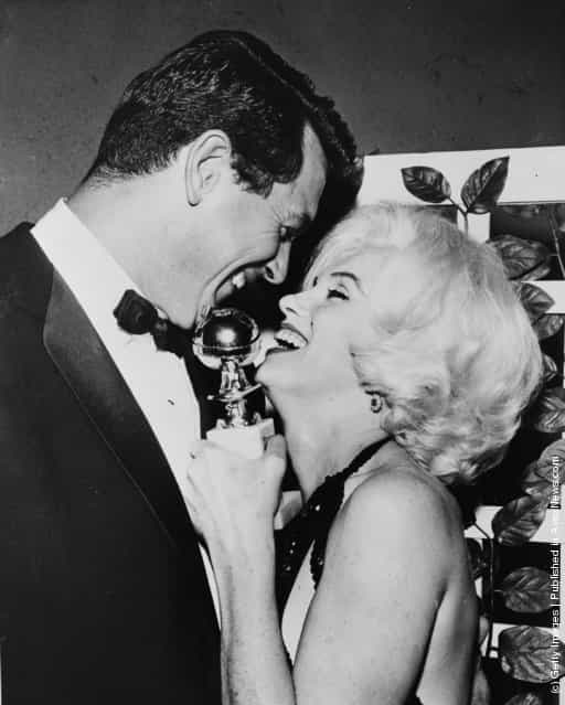 1962: Marilyn Monroe receives her Golden Globe award from Rock Hudson (1925 - 1985) at the Hollywood Foreign Press Associations 19th Annual Dinner