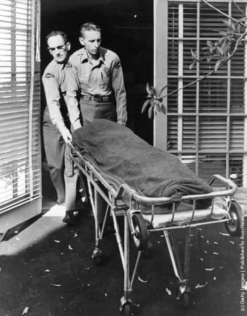 Medical attendents removing the body of Marilyn Monroe (Norma Jean Mortenson or Norma Jean Baker, 1926 - 1962) from her home