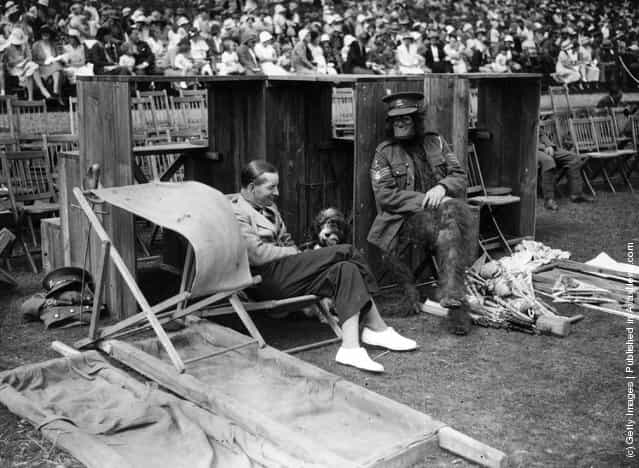 1934: A soldier dressed as an ape, waiting to go on during the Cavalry Activity Ride at Tidworth Tattoo Rehearsal