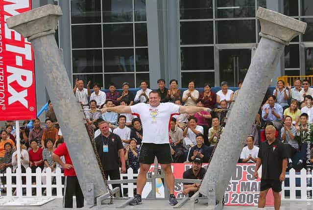 Jessen Paulin of Canada tries to pull two poles during a match of the 2005 Worlds Strongest Man Competition