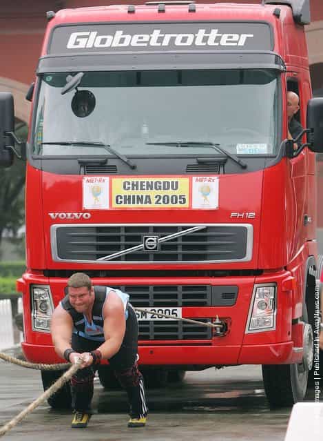Terry Hollands of Britain drags a truck during a match of the 2005 Worlds Strongest Man Competition at Wuhou Temple