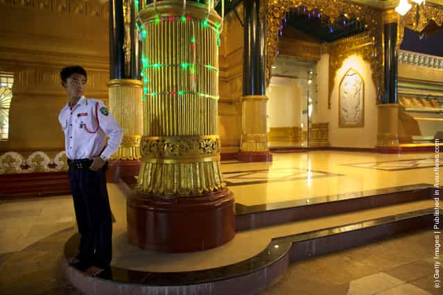 A security guard stands by the Ouparta Thandi pagoda which was built to mirror the famous Shwedagon pagoda