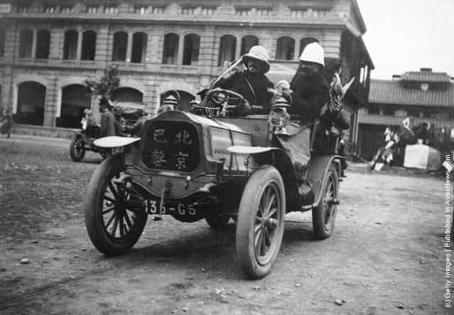 1909: An entrant in the Peking (Beijing) to Paris motor race arrives at the start of the race in a De Dion Bouton