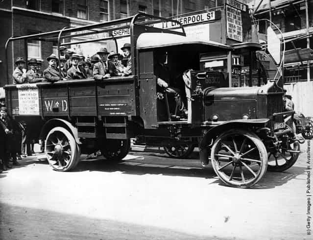 1919: Passengers on board a new London lorry bus, going from Shepherds Bush to Liverpool Street