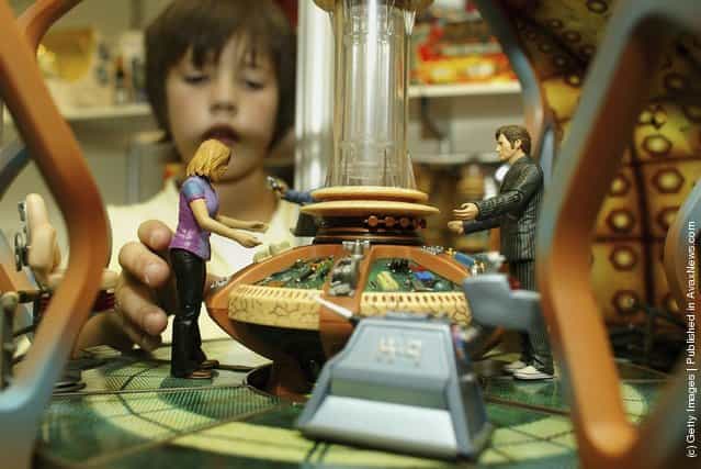 A boy plays with a Dr Who tardis toy at the Deram Toys 2006 exhibition