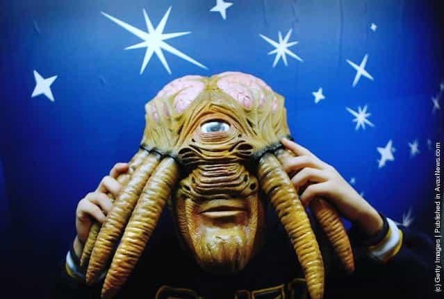 A young boy wears a Doctor Who Dalek Sec Hybrid Voice Changer Mask during the Dream Toys 2007 Christmas predictions fair