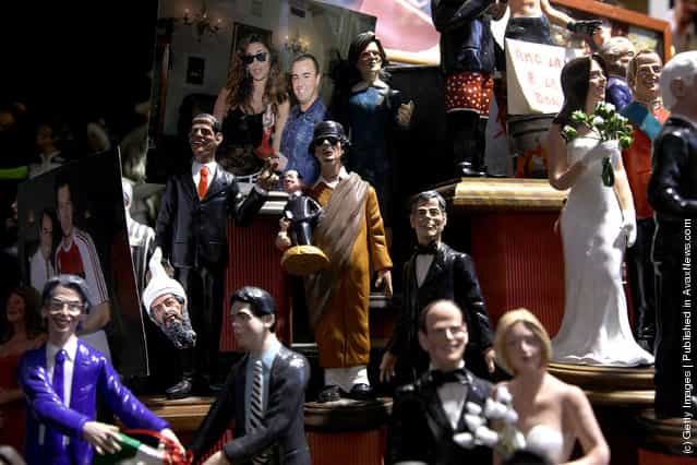 Figurines featuring famous people are shown outside Di Virgilio store at Via San Gregorio Armeno