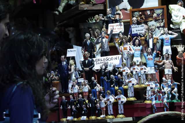 Figurines featuring famous people are shown outside Di Virgilio store at Via San Gregorio Armeno