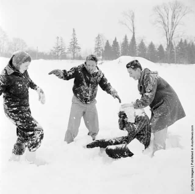 1950: Students who have come to enjoy the winter sports on offer at Tilton School, New Hampshire, involved in a snowball fight