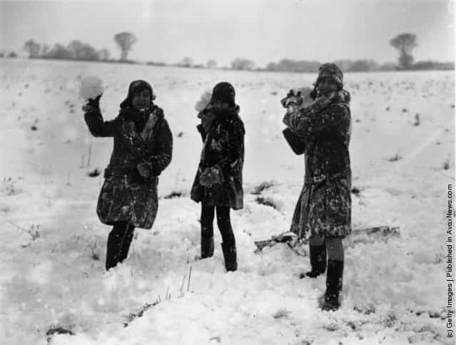 1927: Girls throwing snowballs at Havering, Essex, where the snow has reached a considerable depth