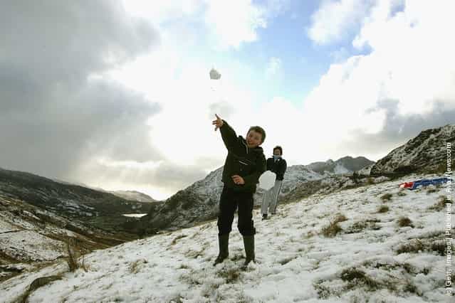 Children enjoy a day off school sledging as they take to the hills and mountains of Snowdonia after the first major snow fall of winter