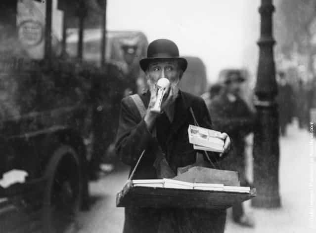 At Christmas toy hawkers, like this one on Ludgate Hill and Holborn, thronged the streets of London, 1913
