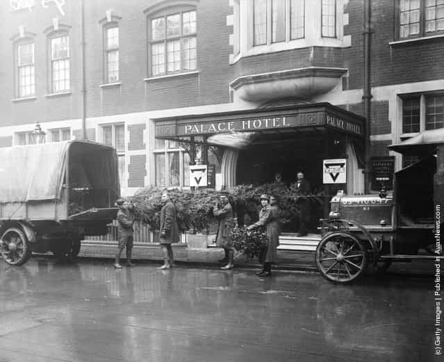1918: Christmas trees being delivered for the members of the American army staying at the Palace Hotel in London