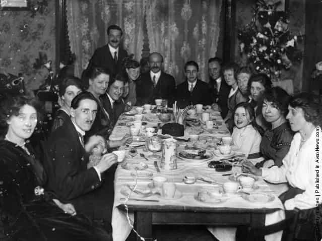 1919: A family sitting down for tea at Christmas time