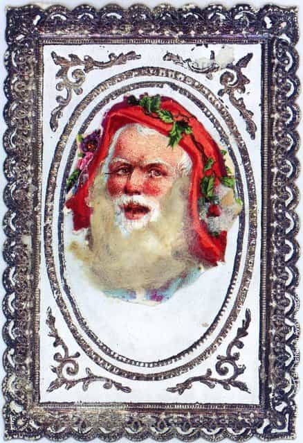 1878: A Victorian Christmas greetings card with the bearded face of Santa Claus