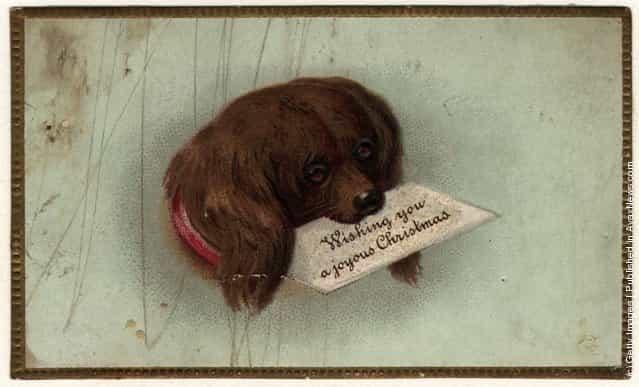 1860: A Victorian Christmas card showing a dog carrying Christmas greetings in his mouth