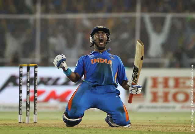 Yuvraj Singh of India celebrates hitting the winning runs during the 2011 ICC World Cup Quarter Final match between Australia and India at Sardar Patel Stadium