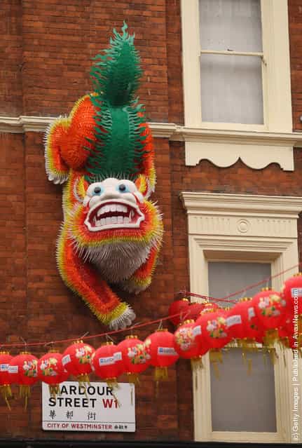 A large Chinese dragon adorns the wall of a building in the Chinatown area of Westminster