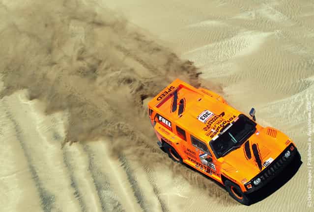 Robbie Gordon of the USA drives his Hummer through the sand dunes on stage one of the 2012 Dakar Rally