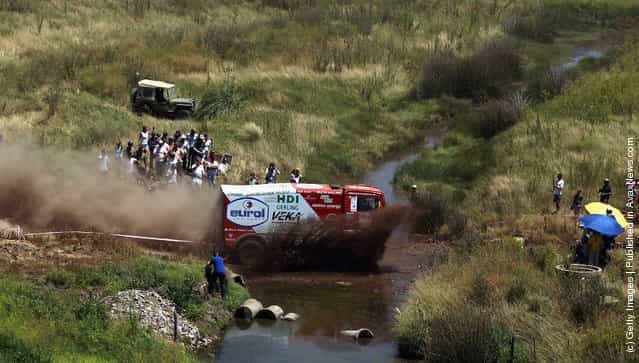Pieter Versluis of The Netherlands drives his MAN truck through a stream during stage one of the 2012 Dakar Rally