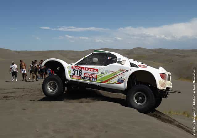 Ronan Chabot of France drives his SMG over a sand dune on stage two of the 2012 Dakar Rally