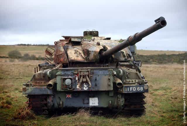 Wrecked tanks are seen close to the road that leads to the village of Imber on Salisbury Plain, England