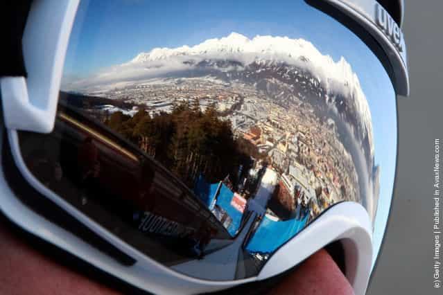 A reflection of the Alps mountain Nordkette is seen in the ski googles of Anders Bardal of Norway