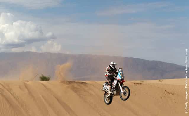 Mauricio Javier Gomez of Argentina and the Paco Gomez Team jumps off a sand dune during stage five of the 2012 Dakar Rally