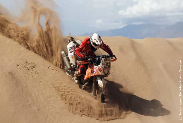 Senkalayci Sakir of Turkey and Turkish Team rides down a sand dunes during stage five of the 2012 Dakar Rally