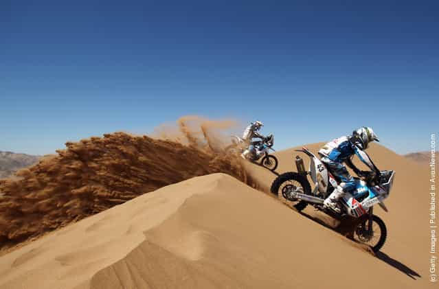 Michael Pisano of France and MP Concept rides over a sand dune during stage seven of the 2012 Dakar Rally